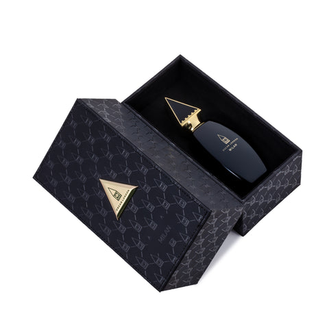 Luxurious Oscar London Milan perfume from the Big Ben Collection, presented in an elegant black leather-textured box with gold accents. The sleek black bottle, featuring a gold triangular cap inspired by Big Ben’s architecture, rests inside the sophisticated case. The rich leather packaging enhances the premium and exclusive appeal of this fragrance.