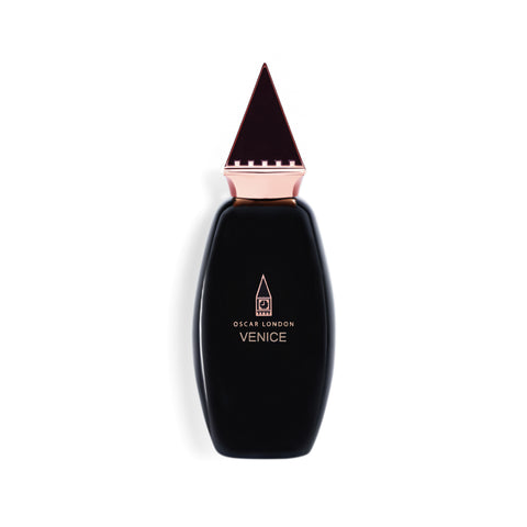 Elegant Oscar London Venice perfume bottle from the Big Ben Collection. The sleek black bottle features a distinctive rose gold triangular cap, inspired by the architectural elements of Big Ben. The minimalist gold-engraved branding adds a touch of luxury, making this fragrance a sophisticated statement piece.