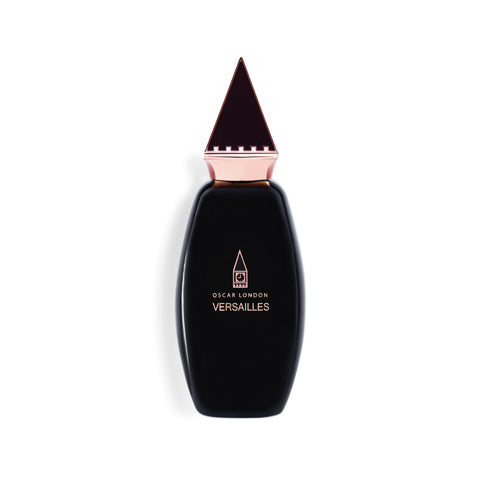 Elegant Oscar London Versailles perfume bottle from the Big Ben Collection. The bottle features a sleek black design with a rose gold triangular cap, inspired by the architectural elements of Big Ben. The minimalist gold-engraved branding enhances its luxurious and sophisticated presentation, making it a statement fragrance