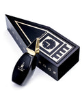 Exclusive Oscar London Big Ben perfume from the Big Ben Collection, presented in a striking black and gold box designed to resemble the iconic Big Ben clock tower. The sleek black bottle, featuring a distinctive gold triangular cap inspired by the tower’s architecture, stands beside the custom-shaped packaging. The luxurious and collectible design enhances the fragrance’s sophisticated appeal.