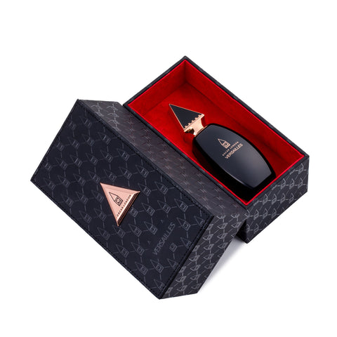 Luxurious Oscar London Versailles perfume from the Big Ben Collection, presented in an elegant black leather-textured box with rose gold accents. The sleek black bottle, featuring a distinctive rose gold triangular cap inspired by Big Ben’s architecture, is nestled inside a rich red velvet-lined interior. The sophisticated leather packaging enhances the premium and exclusive appeal of this fragrance.